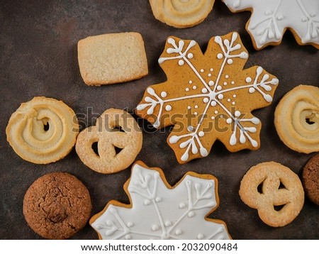 Christmas homemade gingerbread cookies on a wooden background. Christmas homemade cakes.