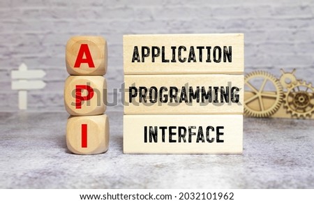 API word written on wood block. application program interface text on table, concept