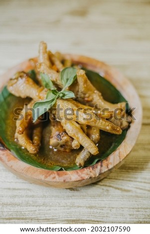 Delicious Rica-Rica Ceker Ayam - INdonesian Traditional Food made from Chicken Feet and Cooked on Chicken Stock,Spices, and Lot of Chilli Pepper.