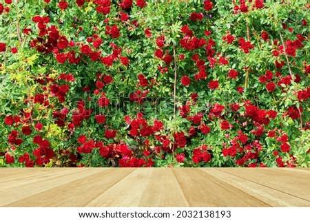 Empty top wooden table on rose flower for product display