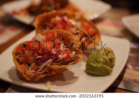 Close-up of Mexican tacos.
Corn tortillas with vegetables.
Mexican food concept.