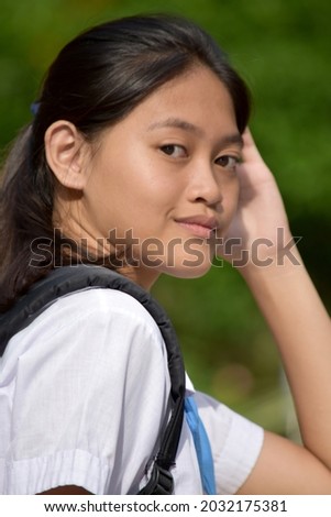 A Young Filipina Female Student Resting