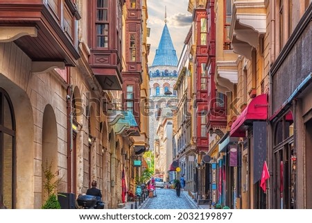 The walls of the narrow turkish street by the Galata Tower, Istanbul Royalty-Free Stock Photo #2032199897