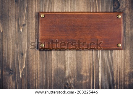 Sign board blank on old vintage wooden wall background