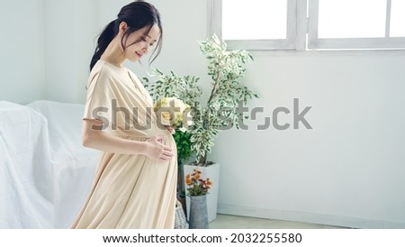 Pregnant Asian woman concept. Maternity photography.