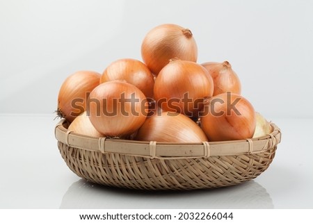 Onion leaves are long, thin, and cylindrical, and the scales inside are widely edible due to their pungent taste and unique aroma. Royalty-Free Stock Photo #2032266044