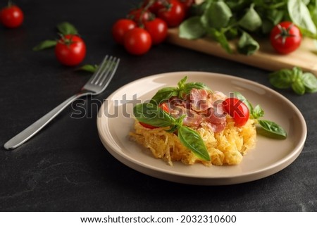 Tasty spaghetti squash with bacon and basil served on black table Royalty-Free Stock Photo #2032310600