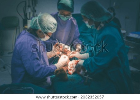 Shot of emergency and serious accident. Medical Team Performing Surgical Operation in Modern Operating Room. Medical team performing surgery in hospital. Group of surgeon at work in operation theater.