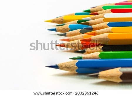 Right side view of various colored pencils. placed on a white background and colored pencils in close-up.Concept art Text copy space and office.