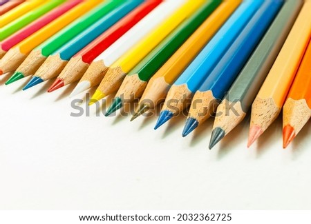 Front view image of various colored pencils. placed on a white background and colored pencils in close-up.Concept art  Text copy space and office.
