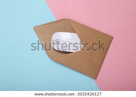 Envelope with pc mouse on blue-pink pastel background. Email