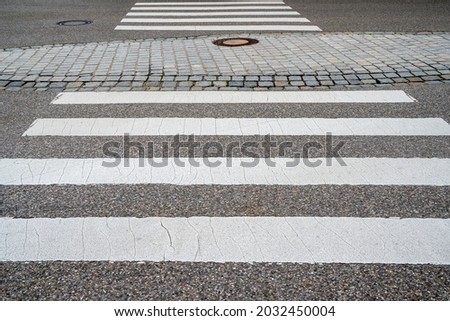 pedestrian crossing with stripes over street