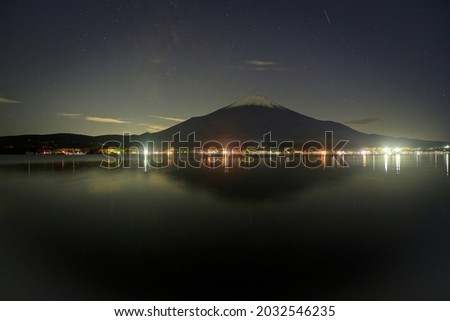 Collaboration scene of Mt. Fuji and starry sky seen from the lakeside at Lake Yamanaka, Yamanashi pref.