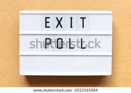 Lightbox with word exit poll on wood background