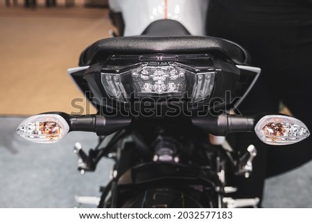 Motorcycle tail brake light. Red tail brake light.