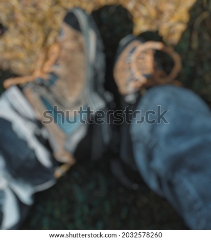 Defocused abstract background of feet wearing shoes 