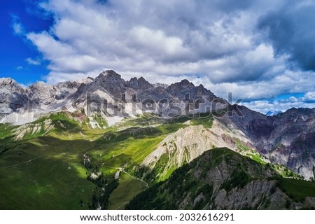 Swiss Alps view from Mount Pilatus, Lucerne Switzerland. Mounts with white gray clouds sky Royalty-Free Stock Photo #2032616291