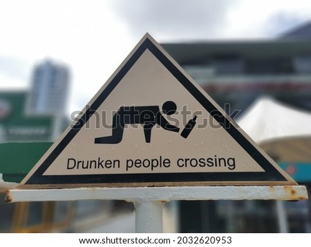 Iconic sign in Patong Phuket. Drunken people crossing.