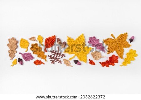 Background with knitting yellow leaves. Autumn concept. Fall mood 