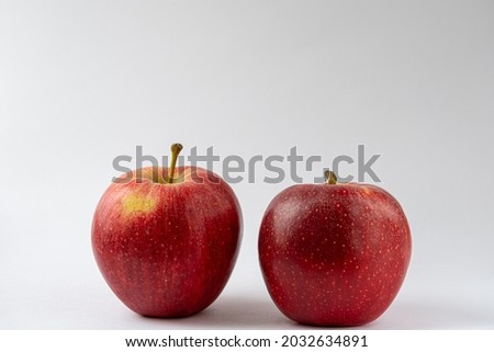 Two red apples against a white background. Royal gala apples. Food product photography