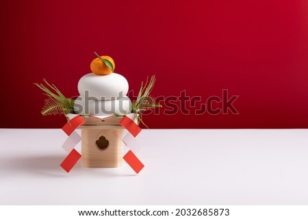 KAGAMIMOCHI is offering to God.
A round rice cake means harmony.Have a wish for a harmonious age.
Red and White Background. Royalty-Free Stock Photo #2032685873