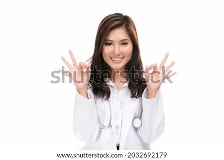 Happy young doctor Asian woman showing OK sign with finger,concept positive emotions and facial expression,portrait of beautiful Asian woman,isolated on white background