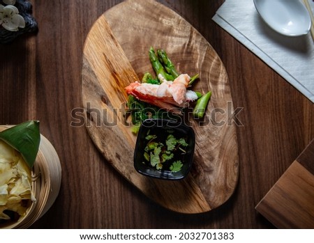 Kingcrab sashimi on a wooden plate