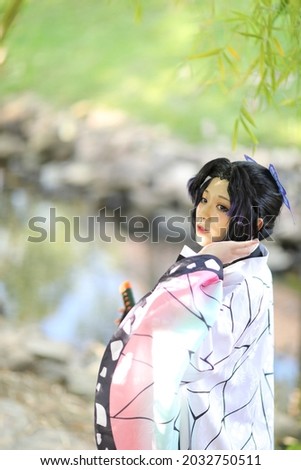 Japan anime cosplay a girl with comic costume with Japanese theme garden