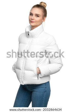 Young woman model posing in white down jacket isolated on white background Royalty-Free Stock Photo #2032864634