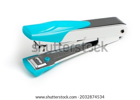 Stapler and metal staple concept over white background.