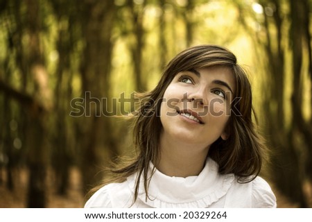 Beautiful happy woman in the autumn park