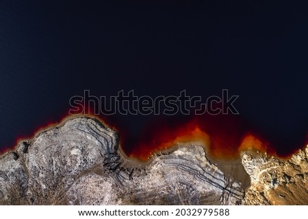 Red Lake of Mitsero. Patterns created in a lake by toxic wastes of nearby mining operations.