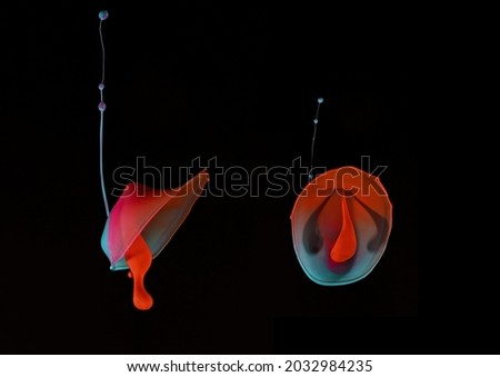 Two images of blue and pink acrylic paint drops falling from above and colliding with orange drops shot up with pressure from below - Liquid Drop Art