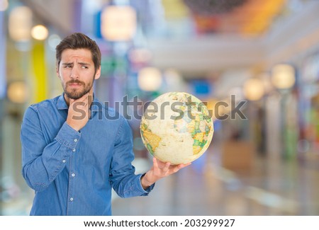 young man with a globe