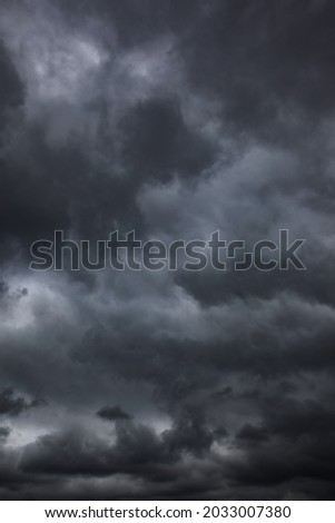 Dramatic sky with black stormy clouds, may be used as background Royalty-Free Stock Photo #2033007380