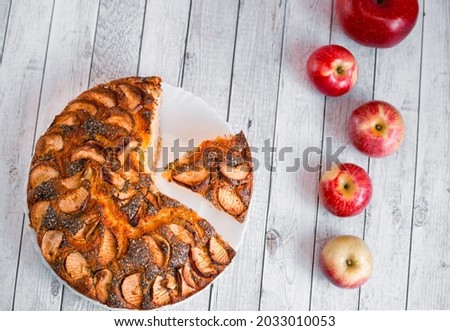 Traditional American apple pie with poppy seeds and fruits slices garnish decor. Autumn seasonal sweet bakery. Festive thanksgiving apple cake recipe .