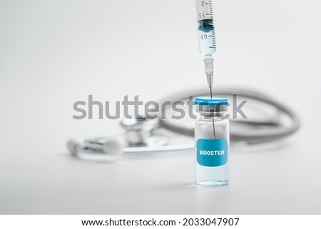 Syringe with liquid vaccines booster. fight against virus covid-19 coronavirus, Vaccination and immunization. diseases,medical care,science, vaccine booster concept. Royalty-Free Stock Photo #2033047907