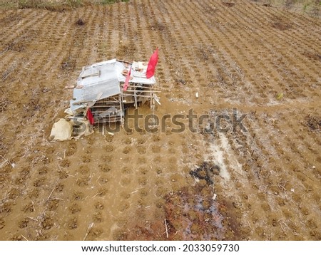 aerial photography of houses in rice fields or plantations of Indonesian farmers who are ready to enter the planting season