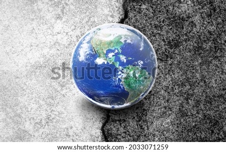 Earth World on Half White and Half Black Concrete Floor, Choose the right way for our world concept, Elements of this image furnished by NASA Royalty-Free Stock Photo #2033071259