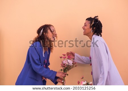 Portrait of two happy woman sharing a moment