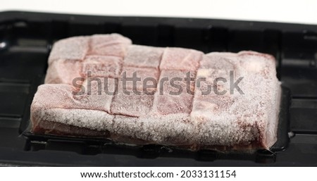 Thawed frozen meat steak isolated on white Background, Food concept Front view Close up.
