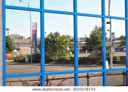 Reflections of Buildings in Mirrored Glass Wall of Modern Building