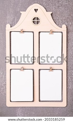 Frame in the form of a house with 4 windows on a dark background for mockup