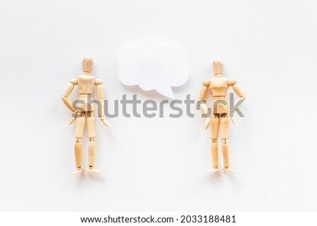 Personal communication concept. Two wooden mannequin figures connection