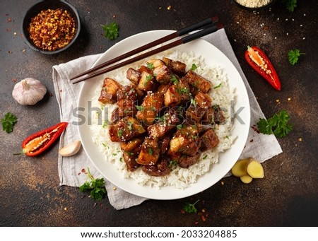 Chinese traditional cuisine sticky braised pork belly with rice on white plate Royalty-Free Stock Photo #2033204885