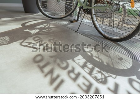 Abstract blurry shade on floor. Interior abstraction with defocused bicycle wheels on background. Concept of college students, knowledge, read text, running letters