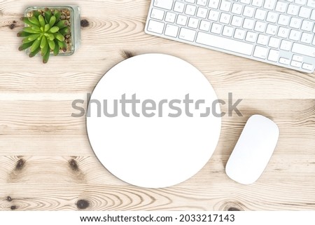 Round mouse pad mock up. Office desk with keyboard Royalty-Free Stock Photo #2033217143