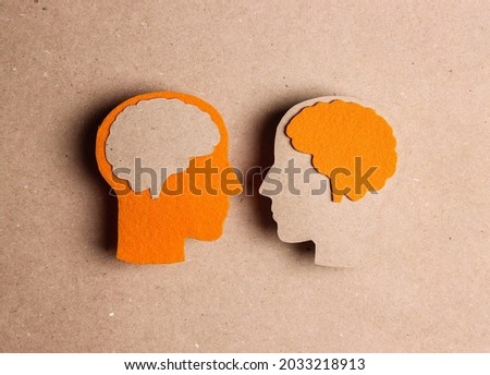 Cardboard profiles with brain symbol on a brown background.. World Multiple Sclerosis Day. Communication, dialogue, exchange of views concept. Royalty-Free Stock Photo #2033218913