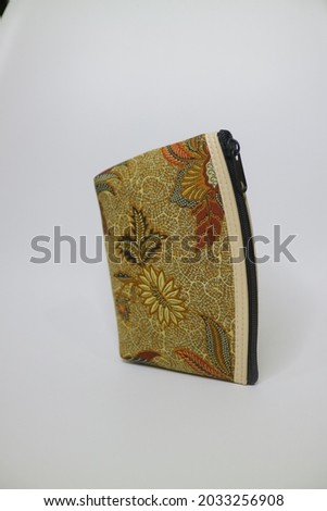 small brown pouch with batik motif photo