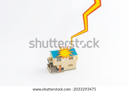 Image of lightning falling on a Japanese house by paper craft Royalty-Free Stock Photo #2033293475